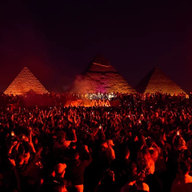 Pyramids glow, house music flows. "Dance With the Gods". Desert beats meet ancient wonders.
