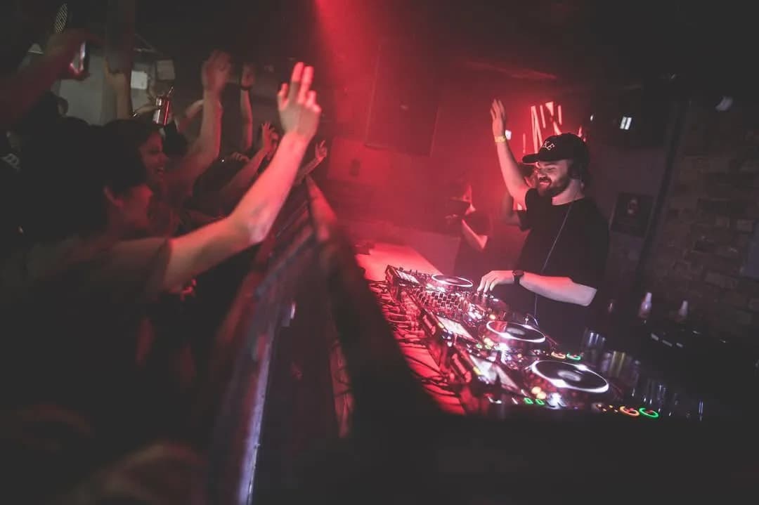 DJ in the Mix at Egg London 2026: Hands flying across the decks, a house maestro unleashes deep grooves and tech house fire on Egg's main room stage, igniting the midweek crowd under strobing lights and warehouse beams for an unforgettable Wednesday Club vibe.