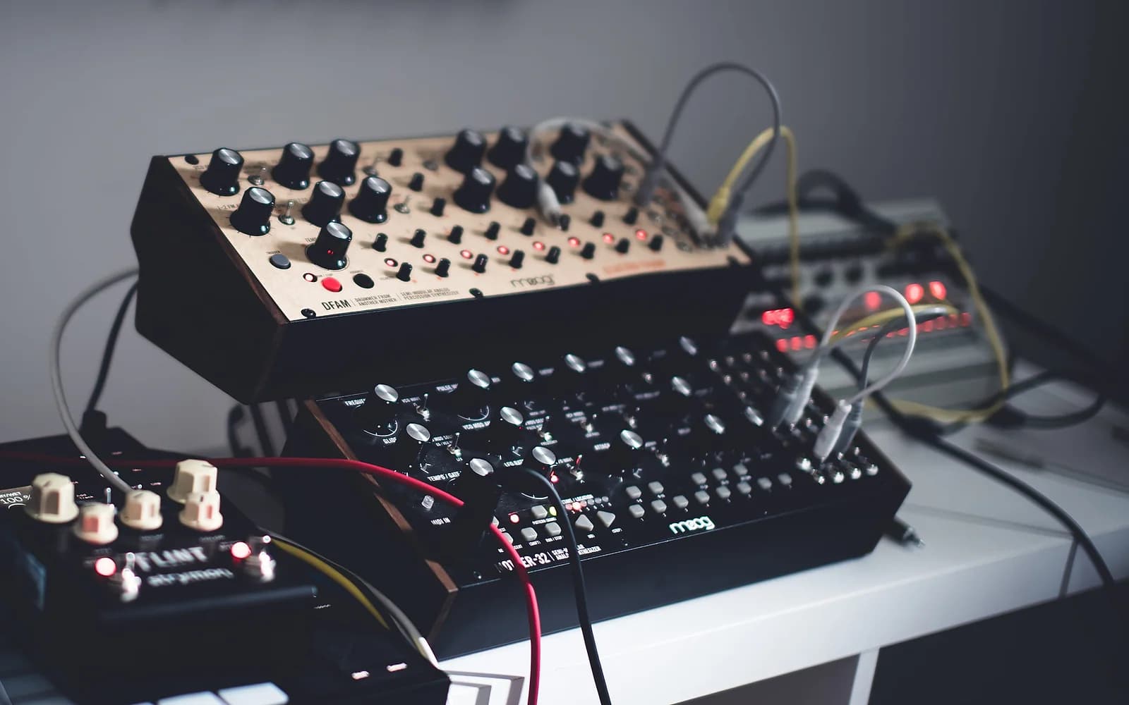 Patched analog gear, the kind of hands-on production Beatport's policy is designed to keep separating from prompt-written tracks.