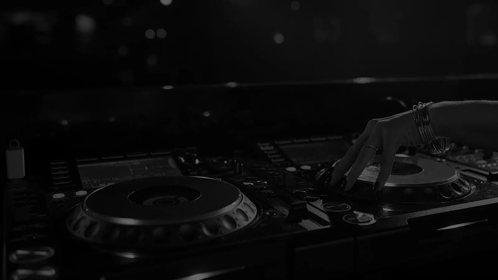 A resident DJ on the CDJs at The Club Khaosan, where tech house and bass house carry most nights.