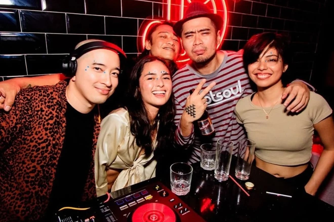 A Manila DJ booth and crowd from PLEASE, one of several small crews building the city's house and techno night economy alongside Cova.