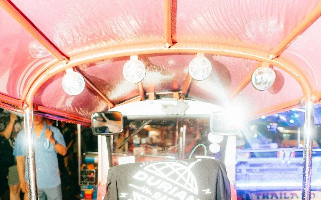 Durian Radio's logo shirt, shot for a recent merch drop that leaned into Bangkok tourist iconography on purpose.