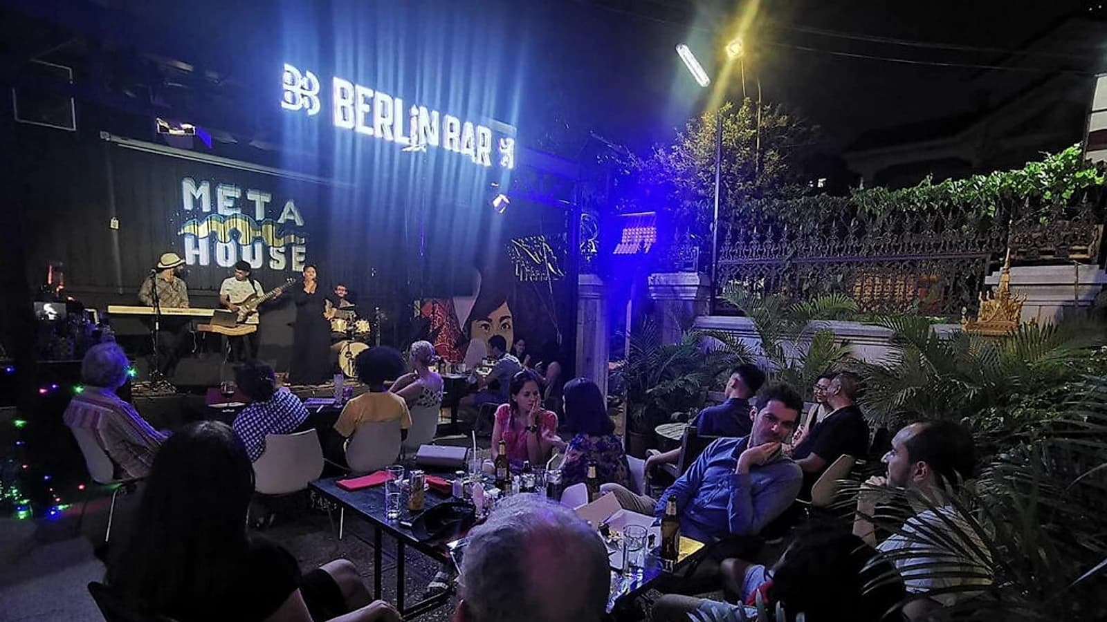 A live set under the Berlin Bar and Meta House signage, part of the venue's regular music program.