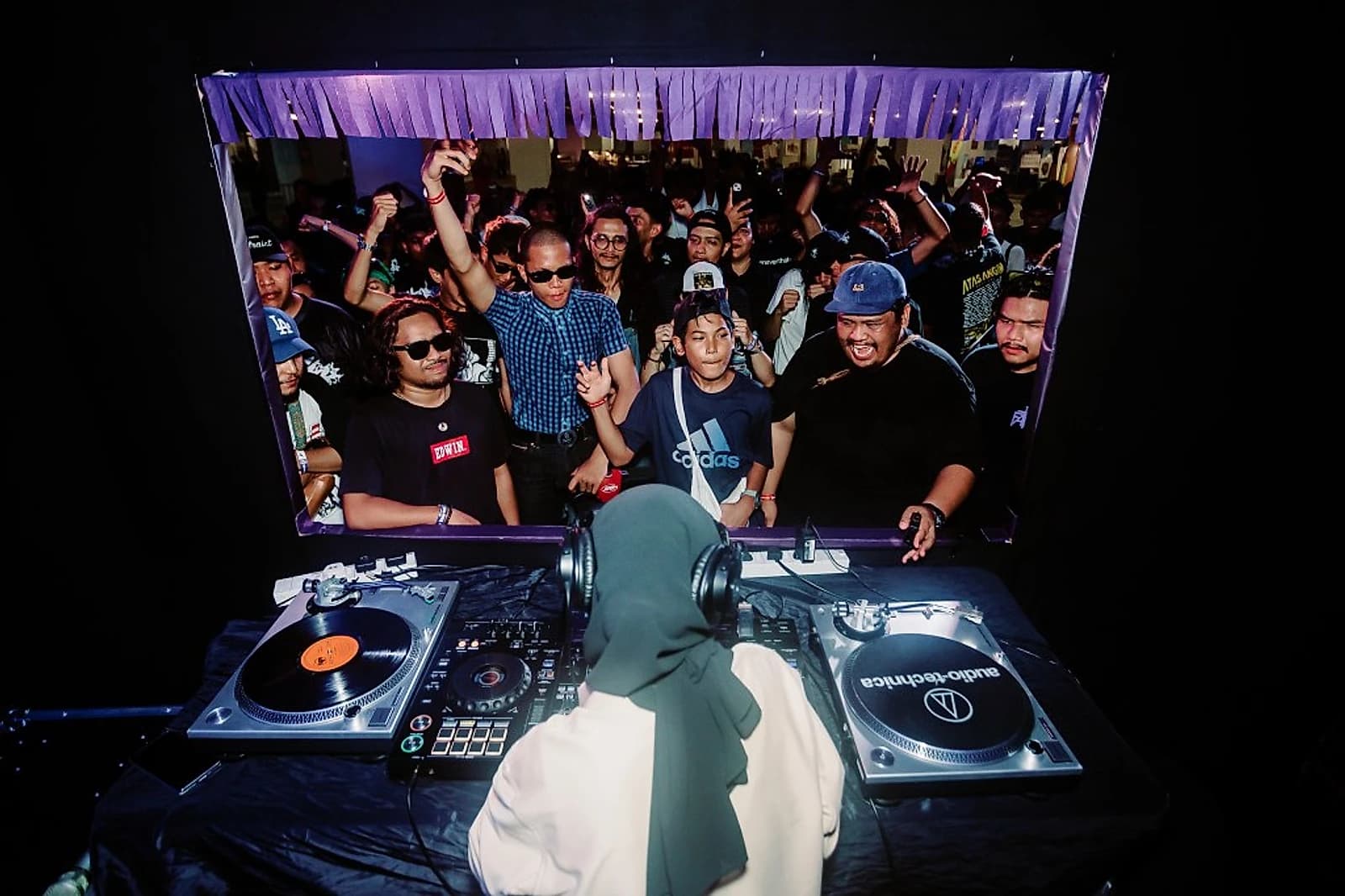 Miko Naiko behind the decks at Atas Angin Festival in Malaysia, March 2024, her first festival booking, eighteen months before Jakarta came calling.