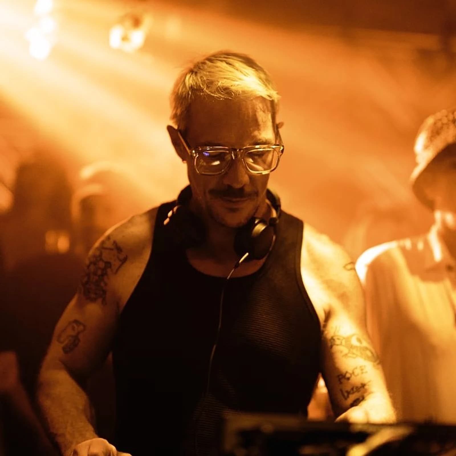 A DJ set underway inside a Phuket club room after dark. Beach clubs on the island split sharply between daytime lounging and a handful of rooms that actually book for the dancefloor.