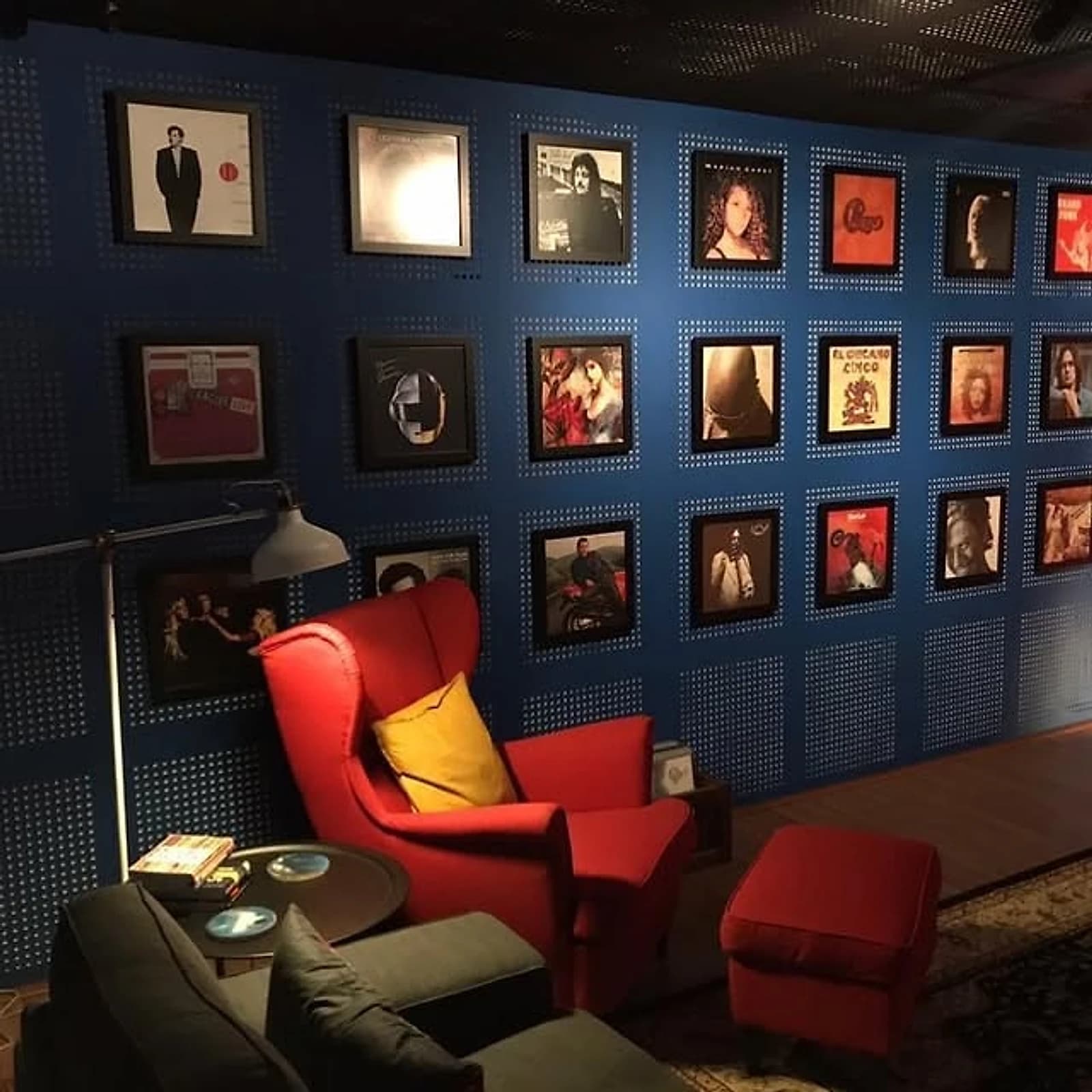 The Groove Room's listening room in Petaling Jaya: a wall of framed vinyl and a chair to actually sit and play them in.
