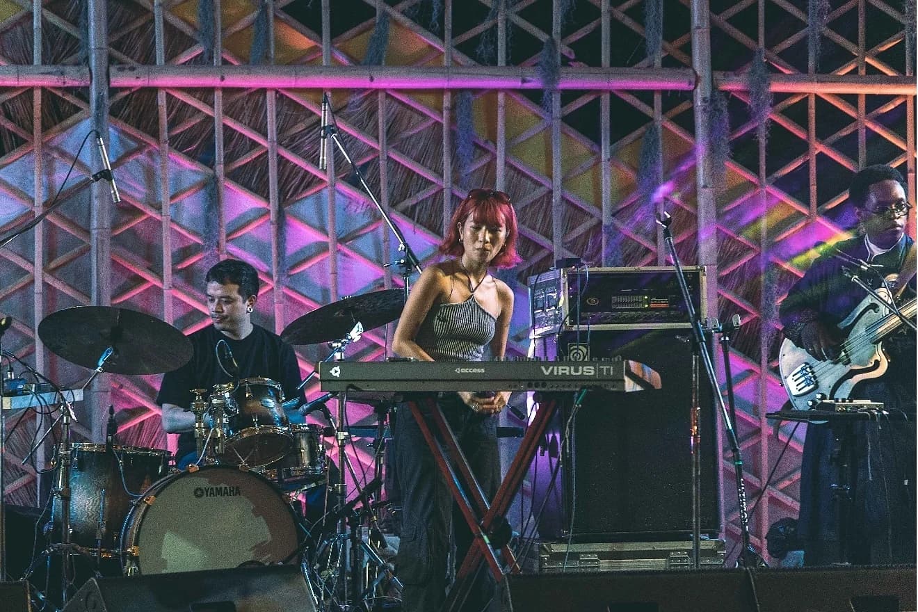 Chucheewa on vocals and keys, performing with The Photo Sticker Machine.