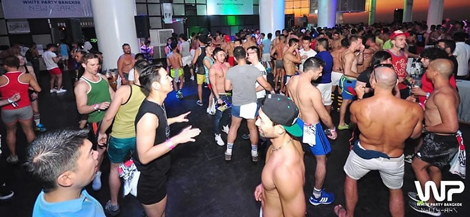 A past White Party Bangkok night: thousands on the floor under the event's own branding.