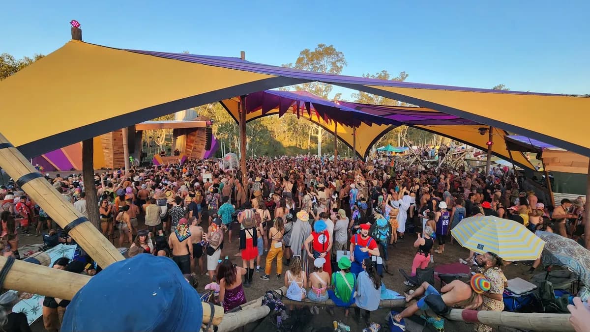 Rabbits Eat Lettuce 2026 at Bushland Hideaway on the Dumaresq River, where the crowd gathers under warm lights and rising house grooves, buzzing with anticipation as the riverfront bush comes alive with freedom, colour and deep melodic house.