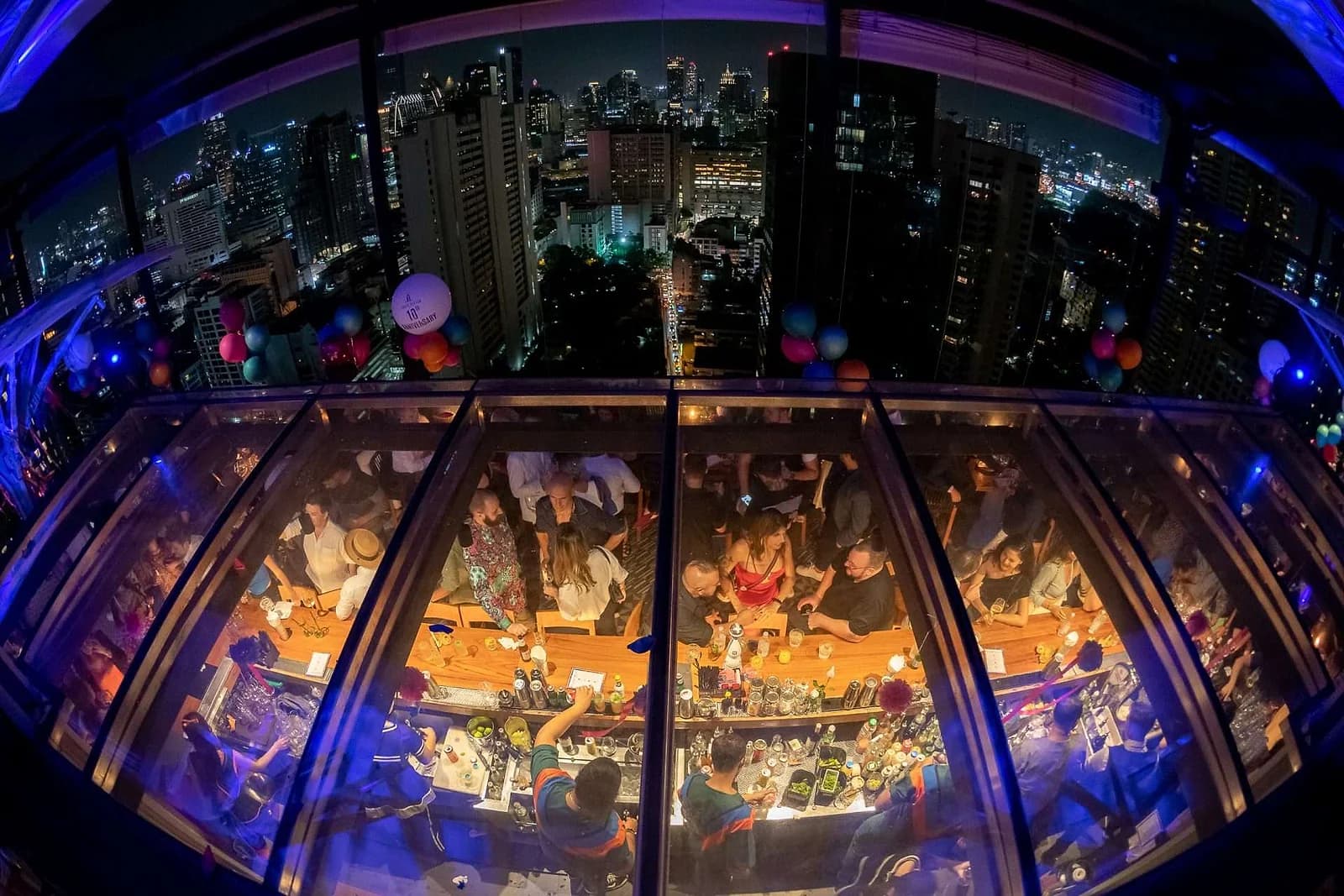 Above Eleven's glass-floored pods hang over Sukhumvit from the 33rd floor of Fraser Suites, packed most nights of the week.