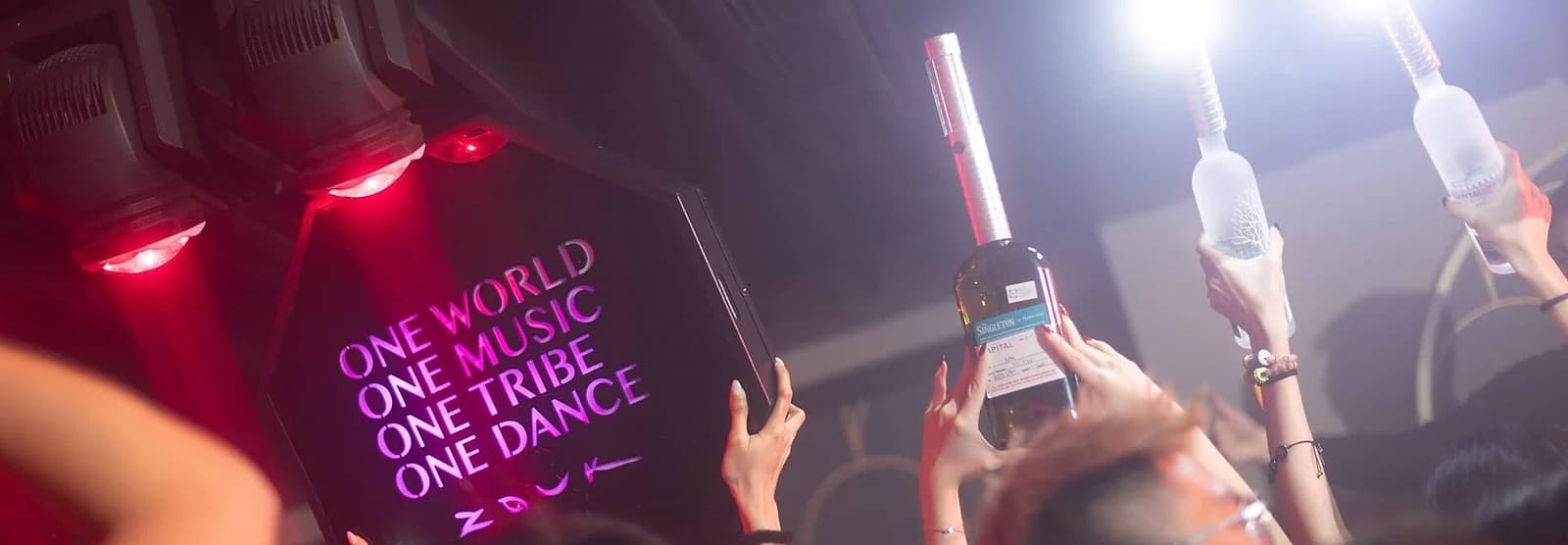 Bottle service at Zouk in Singapore, where the tip is already built into the bill and adding more is considered unnecessary, occasionally even a little patronizing.