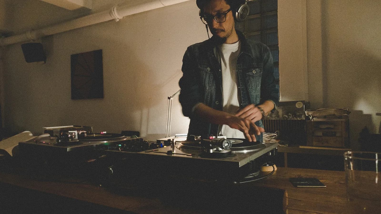 A DJ cues up a record during one of Fono's weekly nights, before the series closed in February 2026.