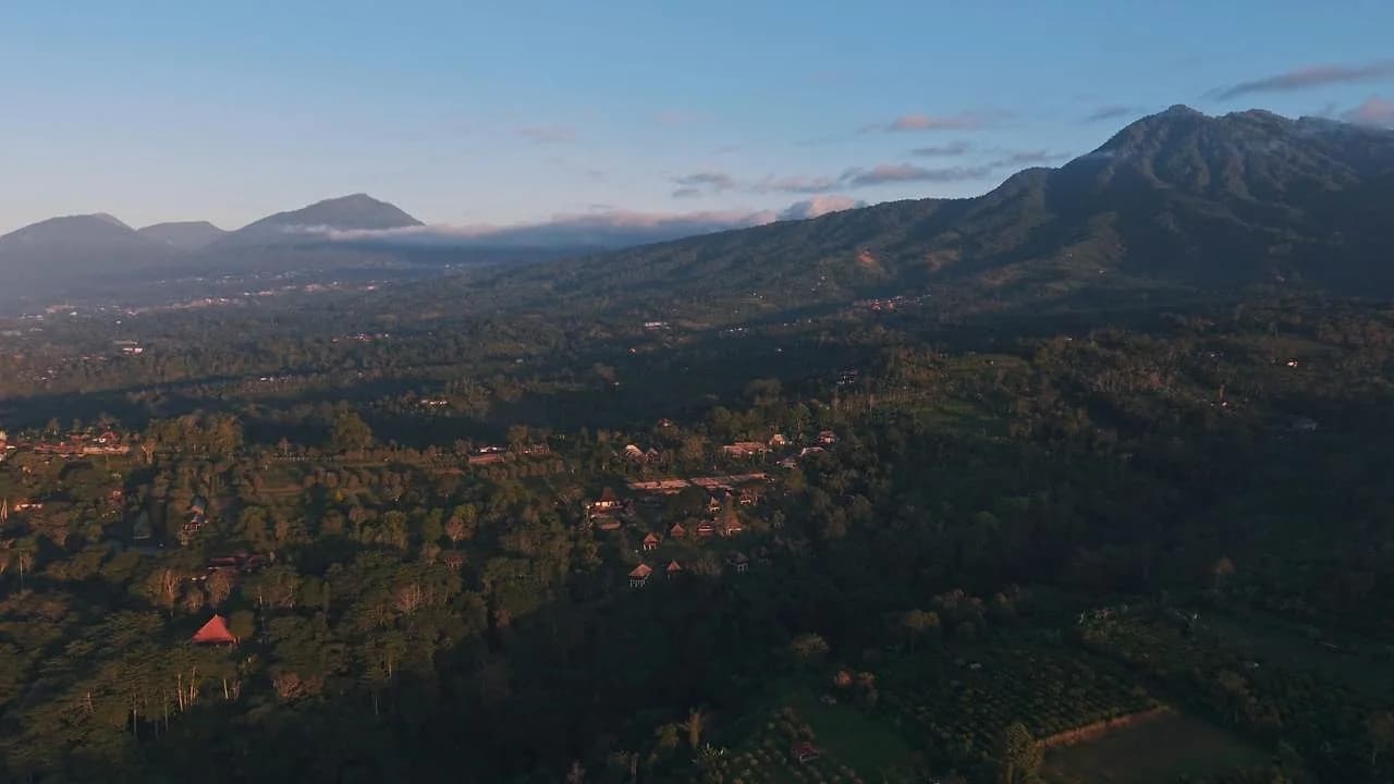 The valley view from Pelaga, with Bali's volcanic highlands behind it. It's the backdrop KAJE is built around, a deliberate contrast to Uluwatu and Canggu's beach clubs.