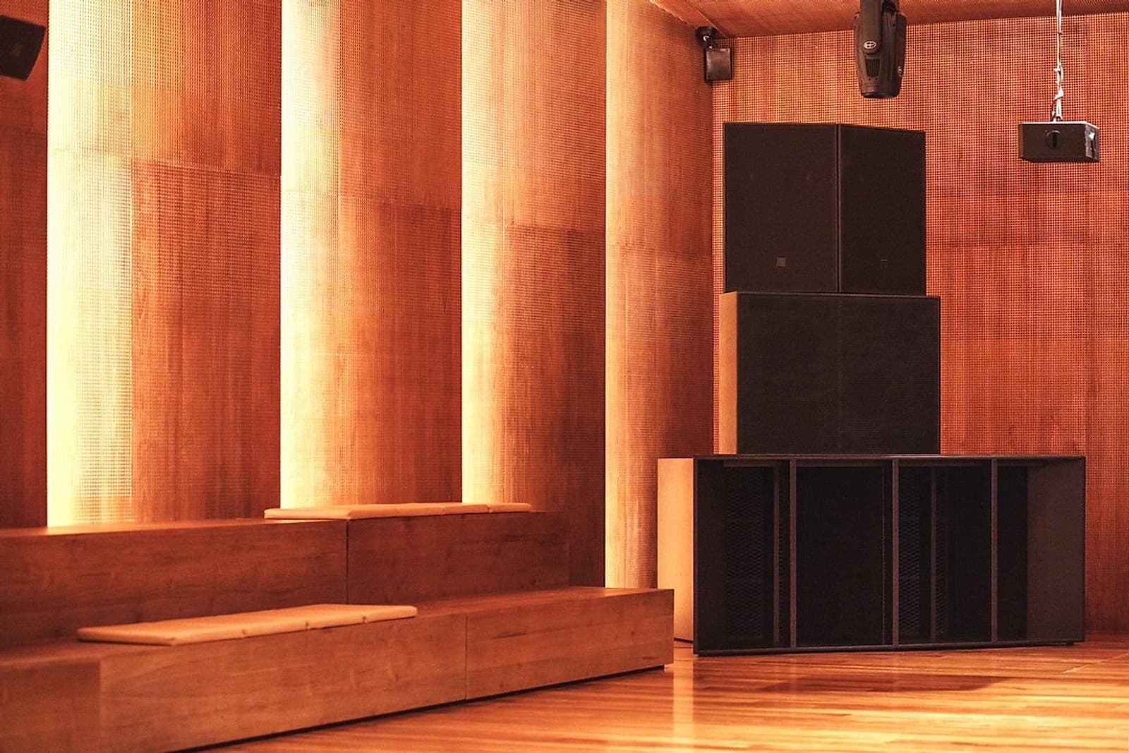 The quad-stack rig George Stavro built to Harvey's specification, set into KLYMAX's perforated wood panelling.