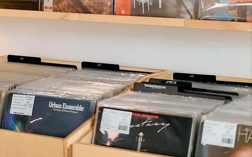 Japanese jazz pressings sit next to dance and soul on the shelves, each one tagged and priced by Lifted Trax.