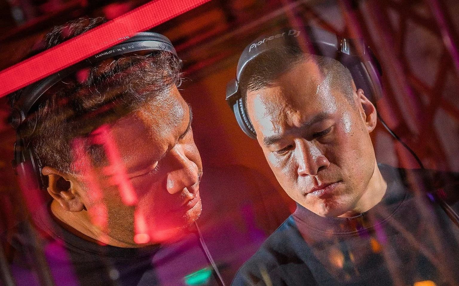 A DJ booth mid-set, the kind of room MI/EN has spent a decade learning to read.