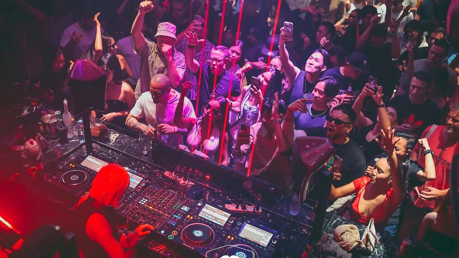 A packed dancefloor at Mustache Bangkok, a club licensed under Thailand's Entertainment Places Act.