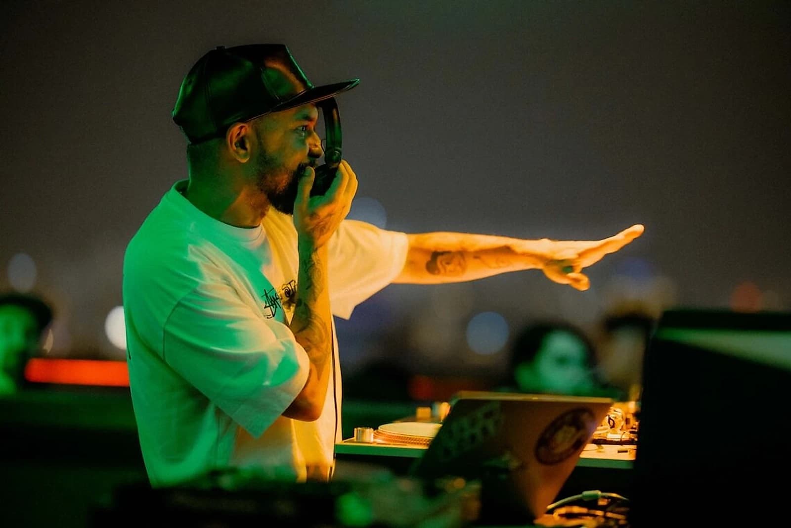 Three-time DMC world champion DJ Craze on HỢP's rooftop booth, the same setup Người Nhà runs on its own nights.