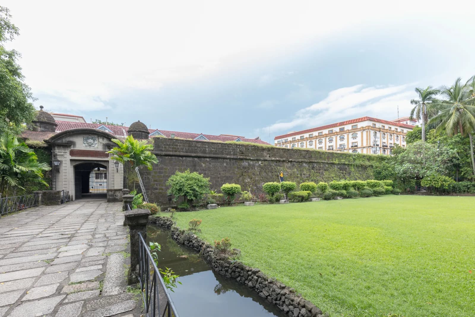 The Puerta Real gate in Intramuros, Manila's walled Spanish colonial district, by day. UNKNWN's anniversary party runs on the gardens just inside it, from afternoon into the following morning.